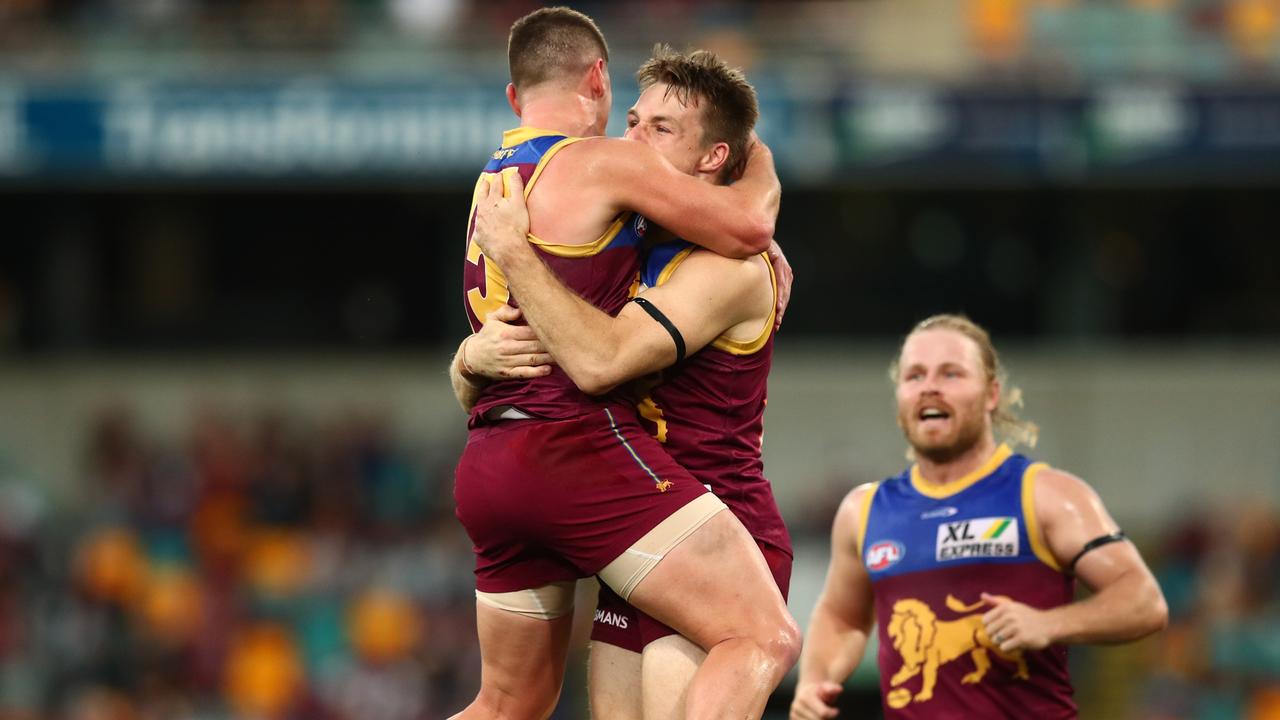 Lincoln McCarthy and Dayne Zorko celebrate during the win over the Gold Coast. Picture: Chris Hyde/AFL Photos