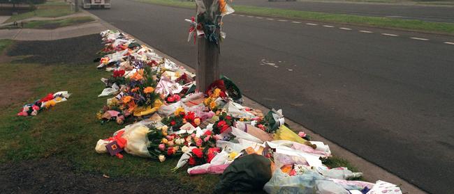 Flowers and tributes placed at the murder scene in Cochranes Rd, Moorabbin, where Sgt Gary Silk and Senior-Constable Rod Miller were gunned down on August 16, 1998, by convicted cop killers Bandali Debs and Jason Roberts.