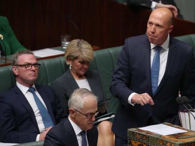 Cabinet ministers Christopher Pyne and Julie Bishop (behind Mr Dutton) could quit immediately if there is a leadership coup. Picture: Gary Ramage