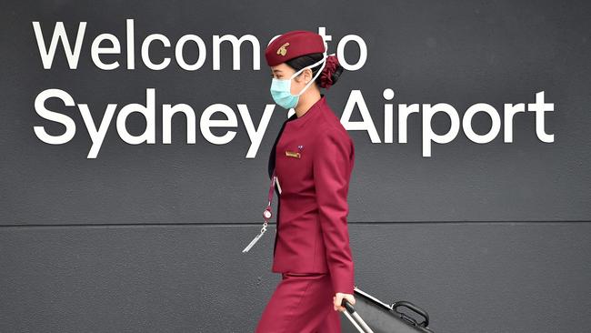 A Qatar Airways crew member enters Sydney international airport in April. Picture: AFP