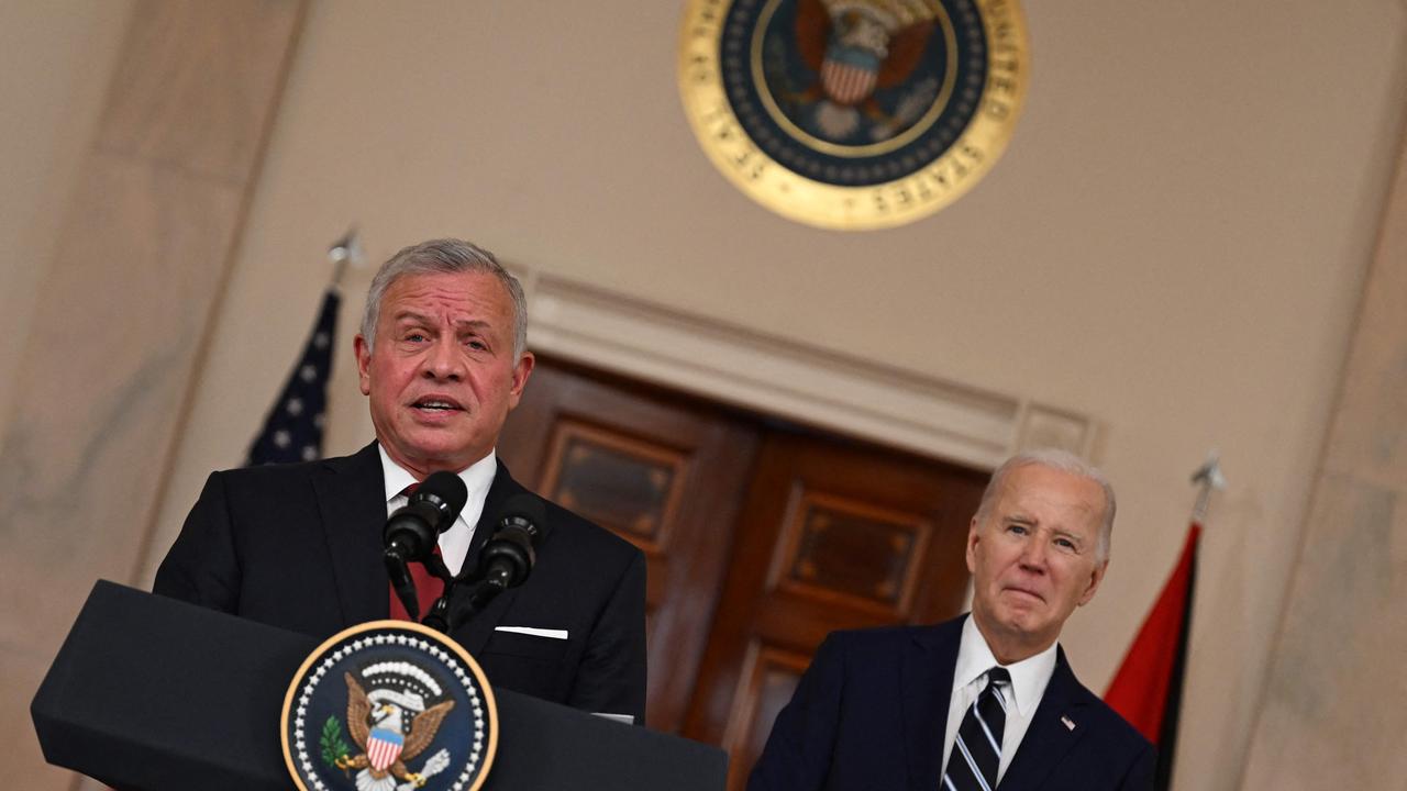 The president gazed down at the floor as if looking for a mark indicating the proper place for him to stand. Picture: AFP