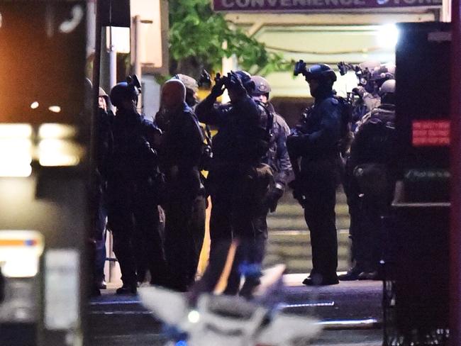 Police storm the Lindt Cafe in Martin Place to end the siege, led by former officer Ben Besant, who shot dead the terrorist. Picture: AAP