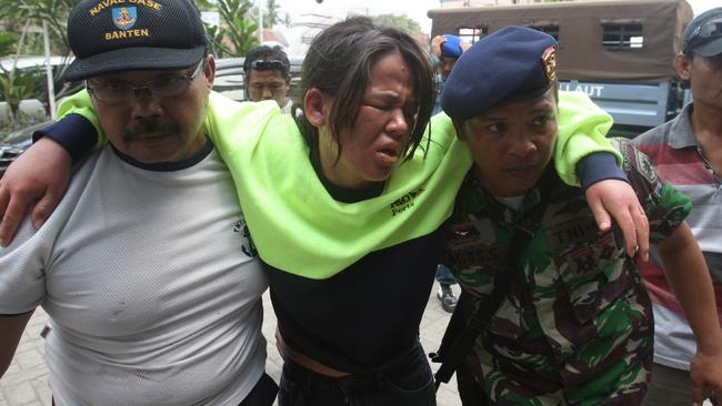 Indonesian marines carry an asylum seeker who was rescued from a troubled boat adrift trying to reach Australia in 2012. Picture: AP