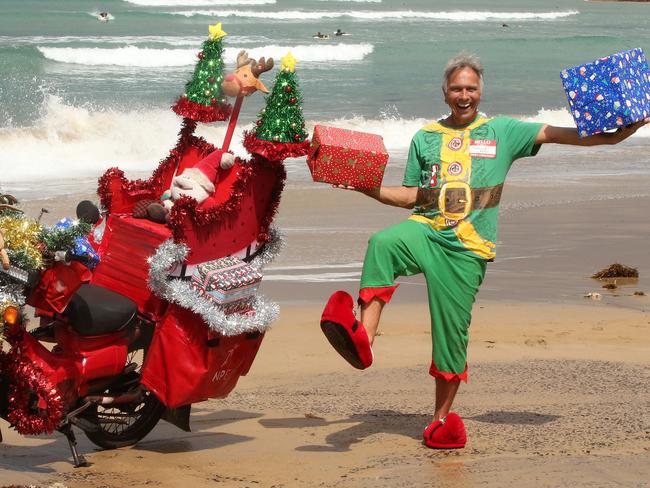 Cam McFarlane on his decorated postie bike much to the delight of Surfcoast locals. Picture: Alison Wynd