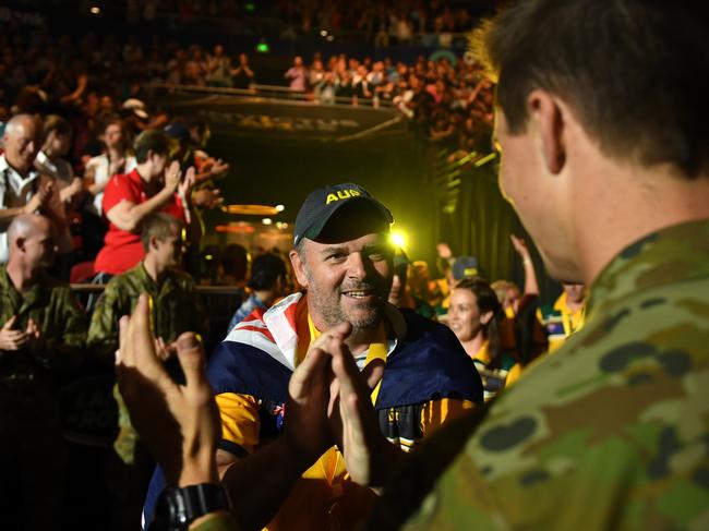 The Australian team enters the arena during the closing ceremony. Picture: AAP Image/Dan Himbrechts