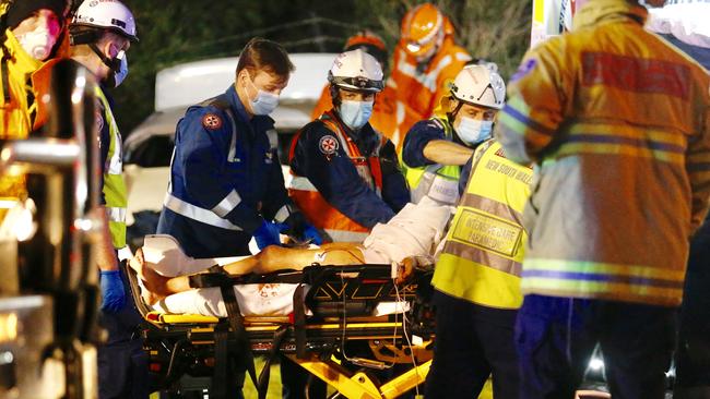 A woman had to be cut out of her car by early this morning in one of a string of serious accidents on Sydney’s roads today. Picture: Steve Tyson