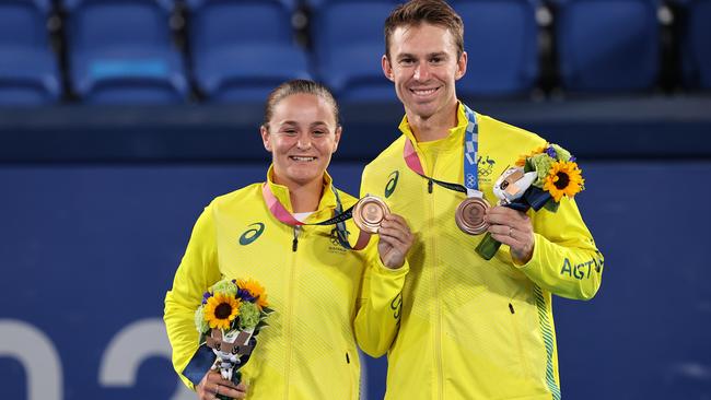 Humble and happy. Bronze medalists Ashleigh Barty and John Peers of Team Australia pose on the podium during the medal ceremony for Tennis Mixed Doubles on day nine of the Tokyo 2020 Olympic Games. Picture: Getty