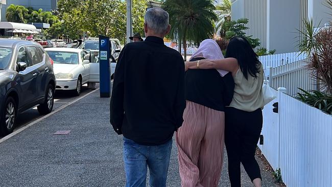 A Top End childcare centre manager Tara Eva Harding is escorted from Darwin Local Court bundled in a pink sweater by her family after facing commercial quantity drug charges.