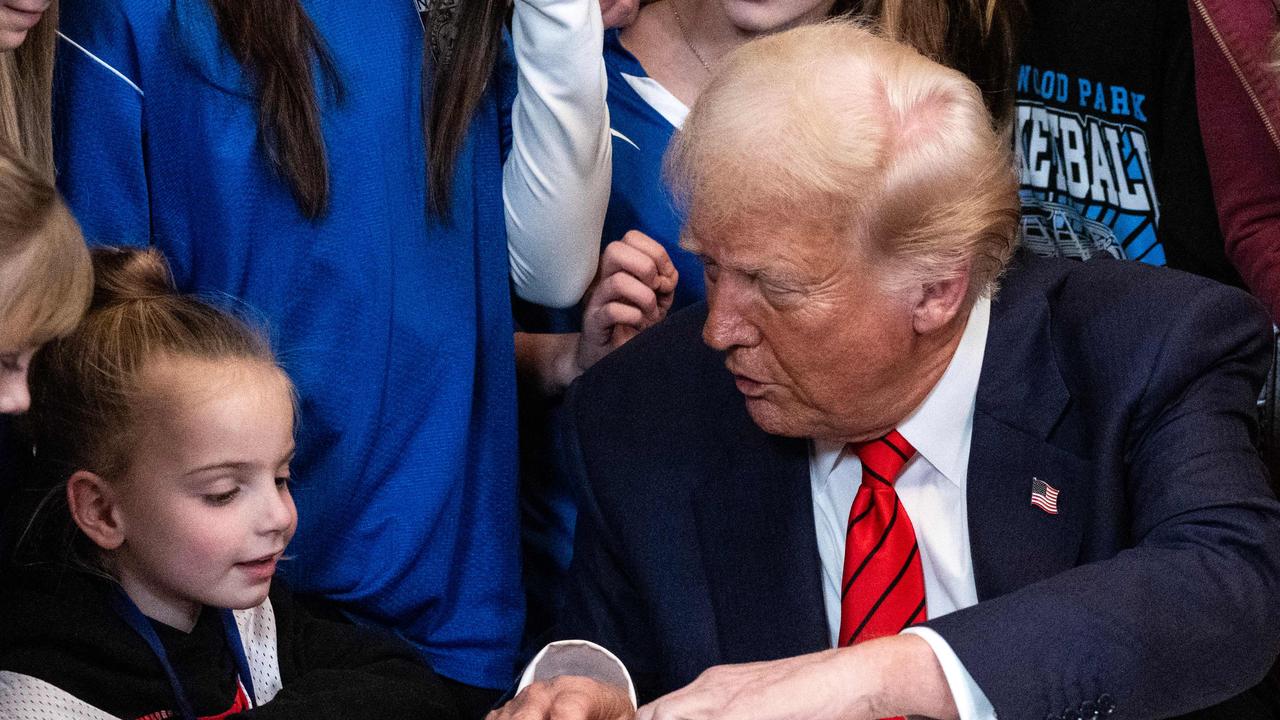 US President Donald Trump signs the No Men in Women’s Sports Executive Order into law. (Photo by ANDREW CABALLERO-REYNOLDS / AFP)