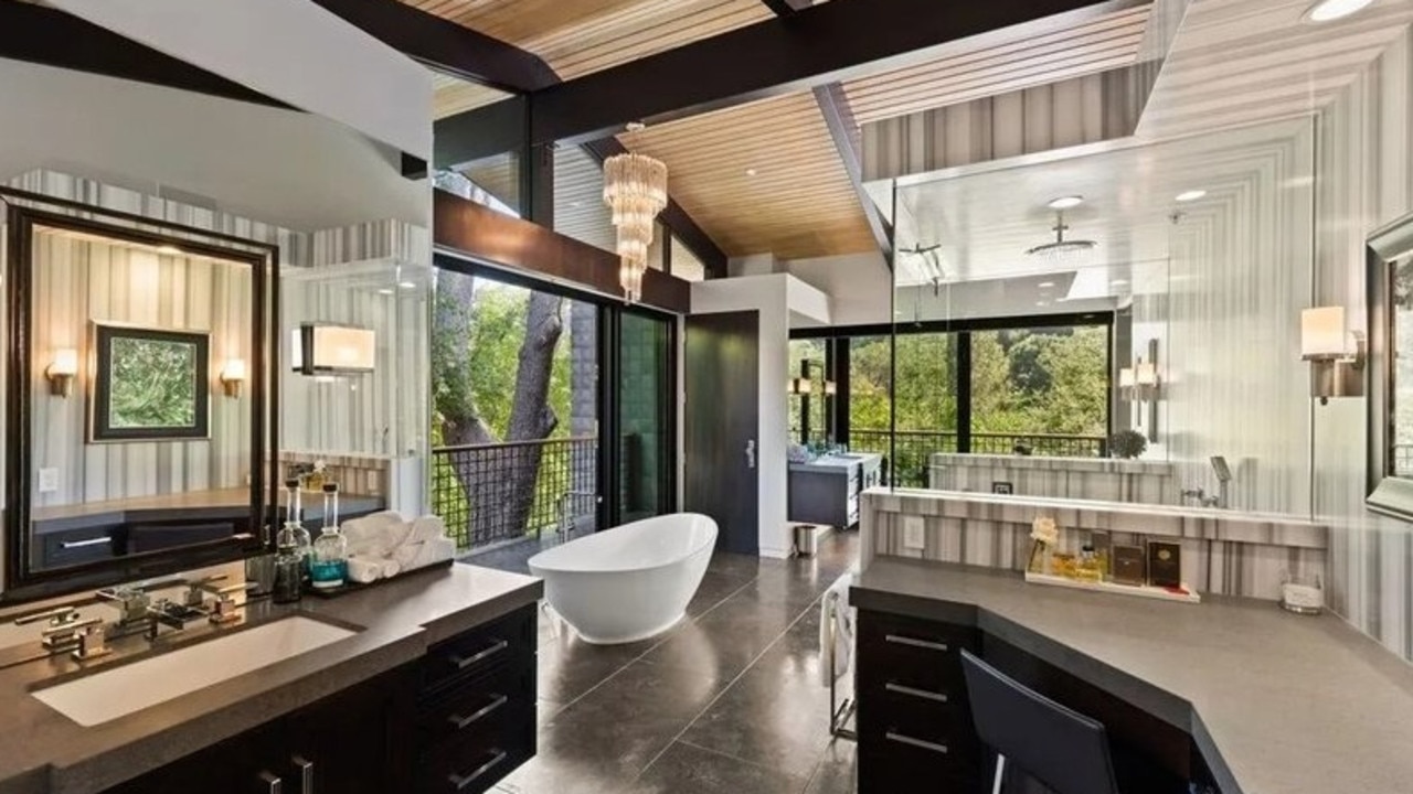 There’s a sculptural tub and dual vanities in the main bathroom. Picture: Realtor