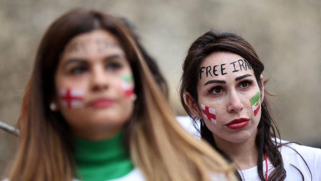 British-Iranian women take part in a demonstration opposite the Houses of Parliament in central London on November 19, 2022, ahead of Iran's fixture against England in the 2022 FIFA World Cup.