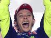 Italian MotoGP rider Valentino Rossi of the Movistar Yamaha MotoGP team celebrates after winning the final of the MotoGP race on the last day of the Grand Prix at the Losail International Circuit in Doha, Qatar, Sunday, March 29, 2015. (AP Photo/Osama Faisal)