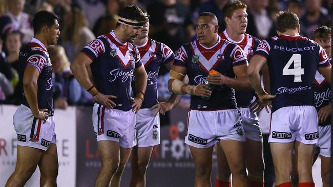 SYDNEY, AUSTRALIA - JUNE 07: The Roosters look dejected after a Sharks try during the round 13 NRL match between the Sharks and the Roosters at Remondis Stadium on June 7, 2015 in Sydney, Australia. (Photo by Mark Kolbe/Getty Images)