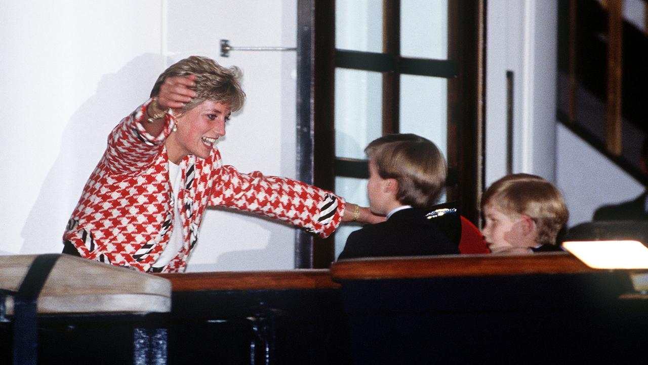 <b>1991: </b>An overjoyed Princess Diana rushes to throw her arms around Prince Harry and Prince William – after a period of separation – as they join their parents on the royal yacht Britannia for a royal tour of Canada. The heartbreaking footage would later be replayed countless times after Diana’s tragic death. Picture: Jayne Fincher/Princess Diana Archive/Getty