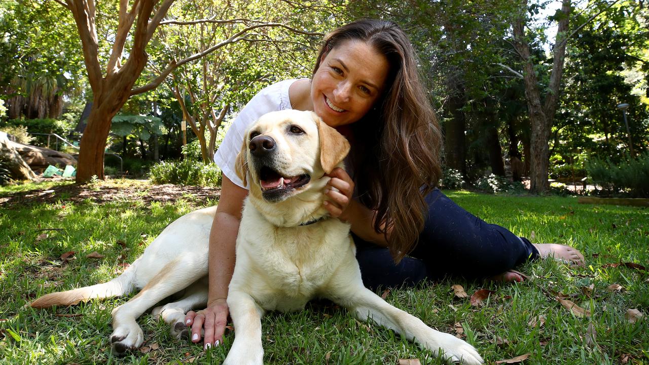 Kim McTeigue with her rescue dog Max. Through her and husband Michael's business SavourLife dog food they have donated more than $1 million to help rescued dogs find a new home. Picture: Toby Zerna