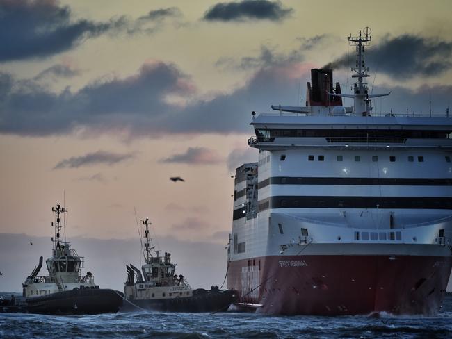 Tugboats help out Spirit of Tasmania during some high winds. Picture: Tony Gough