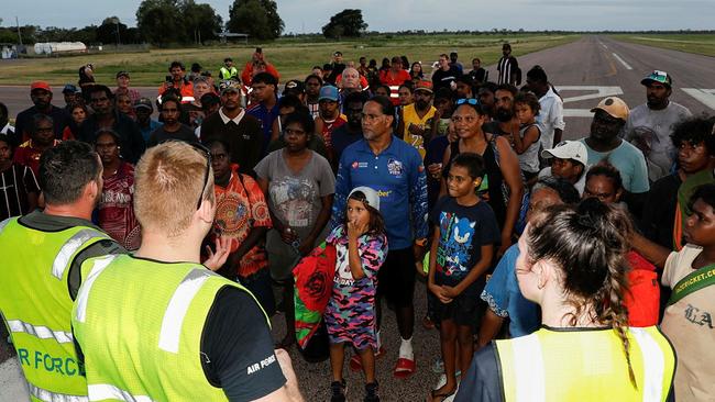 Borroloola residents on the airstrip before evacuating from their flood-hit town.