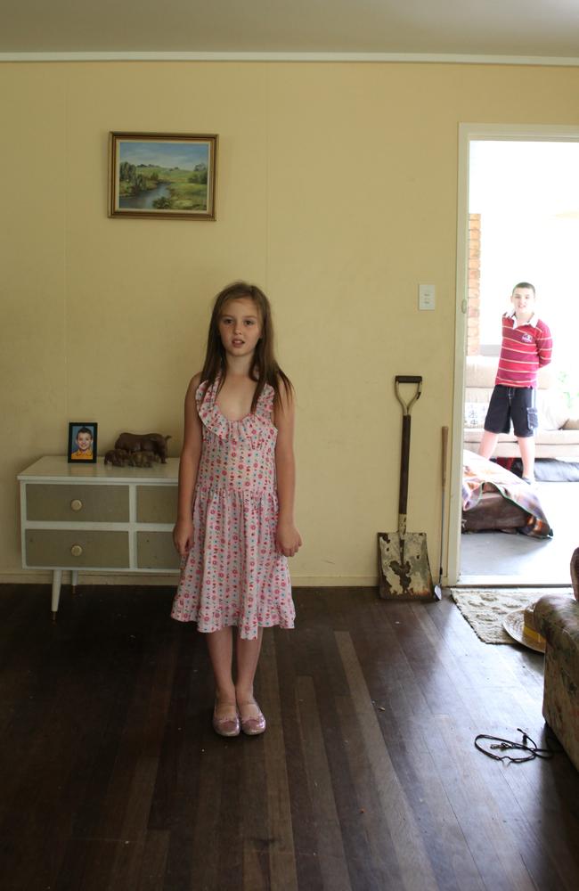 Lara Craig, then 9, and brother Ryan, 11, in 2011 after the floods hit. Picture: David Kelly