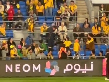 Video shows pitch invader's escape halted by fellow spectator