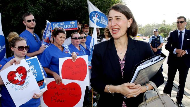 NSW Premier Gladys Berejiklian talks with protesters at Mingara Recreation Club this morning ahead of her first cabinet meeting outside Sydney. Picture: Sue Graham