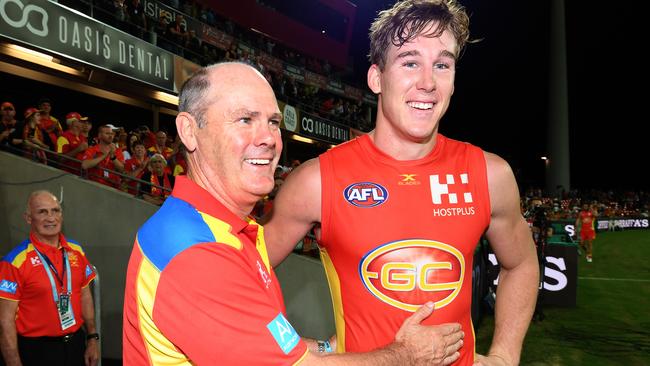 Gold Coast Suns coach Rodney Eade celebrates a win with captain Tom Lynch. Picture: AAP Images