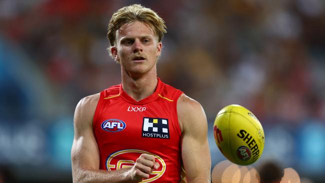 GOLD COAST, AUSTRALIA - APRIL 13: Bodhi Uwland of the Suns warms up during the round five AFL match between Gold Coast Suns and Hawthorn Hawks at People First Stadium, on April 13, 2024, in Gold Coast, Australia. (Photo by Chris Hyde/Getty Images)