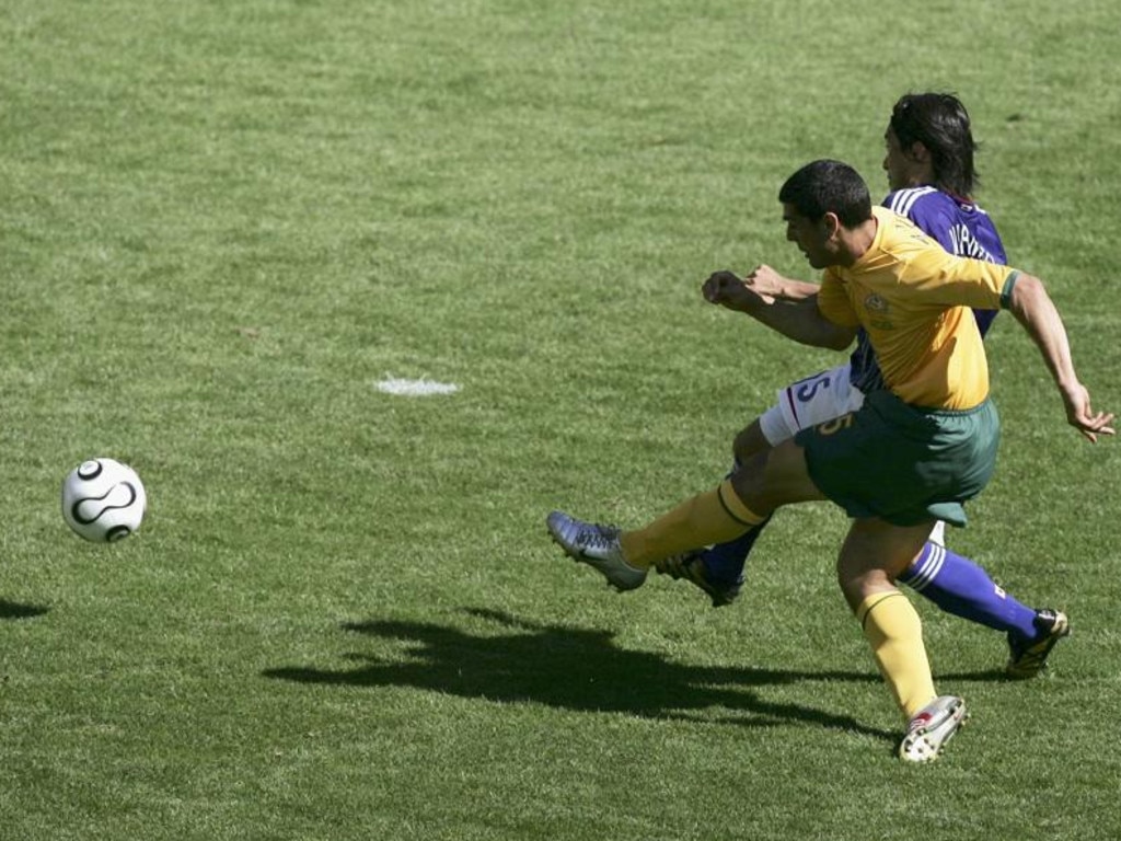 John Aloisi scores for the Socceroos against Japan at the 2006 World Cup. Picture: Ben Radford / Getty Images