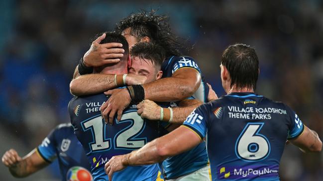 Beau Fermor of the Gold Coast Titans celebrates with team mates after scoring a try during the round three NRL match between Gold Coast Titans and Newcastle Knights at Cbus Super Stadium, on March 22, 2025, in Gold Coast, Australia. (Photo by Albert Perez/Getty Images)