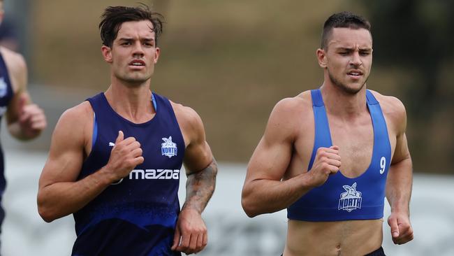 MELBOURNE , AUSTRALIA. November 24, 2023. AFL Australian Rules preseason training.   Jy Simpkin and Luke Davies-Uniacke of the Kangaroos  during North Melbourne training today  . Pic: Michael Klein