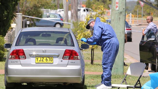 Forensics lift prints from a car at the scene of the murder in Lonus Street, Whitebridge in 2018. Picture by Peter Lorimer.