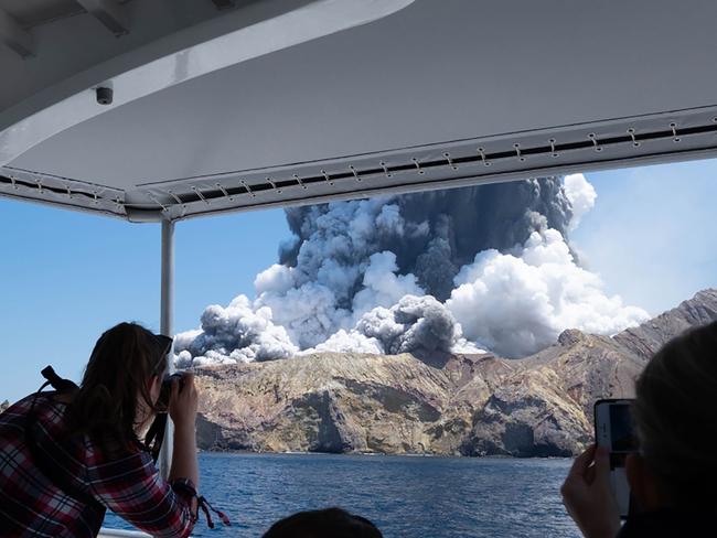 This handout file photograph released courtesy of Michael Schade and taken on December 9, 2019 shows the volcano on New Zealand's White Island spewing steam and ash moments after it erupted. Picture: Handout / Michael Schade / AFP