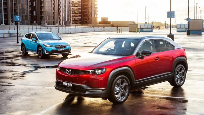 The Subaru and Mazda dip their toes in the environmentally friendly waters with the new XV Hybrid and MX-30 Hybrid. Shot by Thomas Wielecki