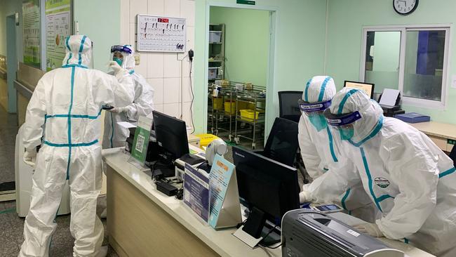 Medical staff in protective suits at Zhongnan hospital, Wuhan. Picture: AFP