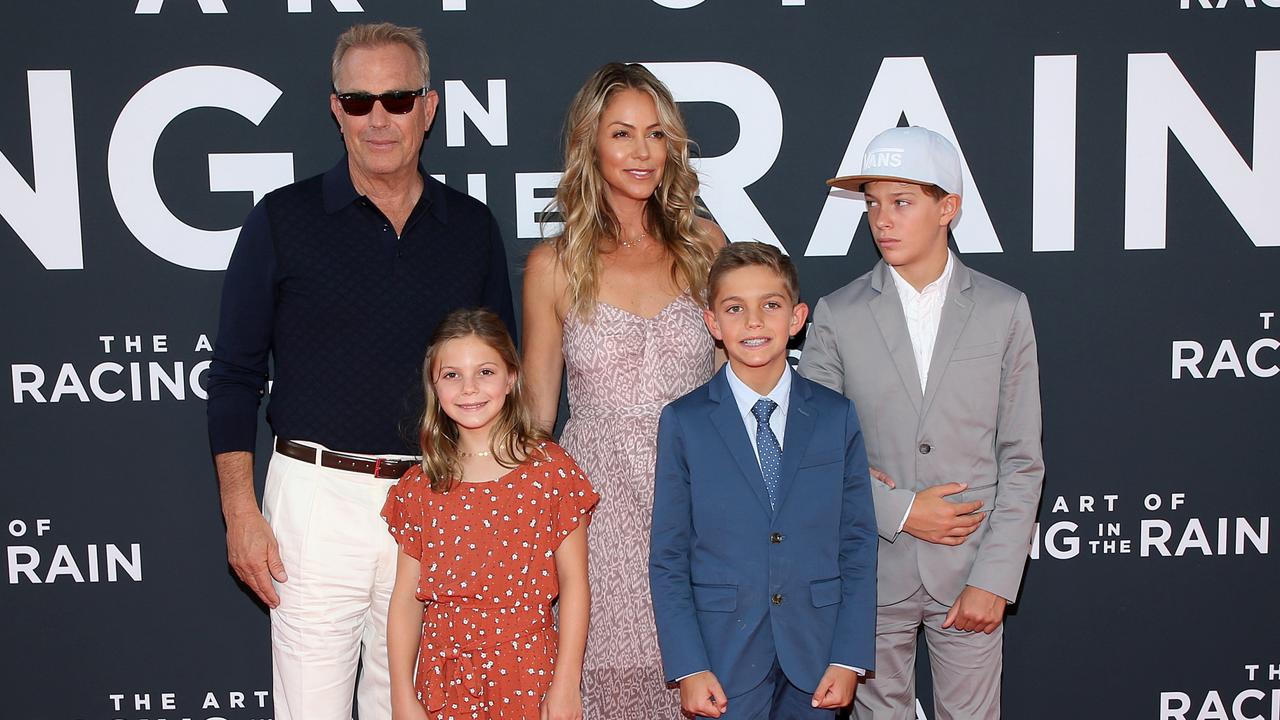 The former couple with their three children in 2019. Picture: Phillip Faraone/Getty Images