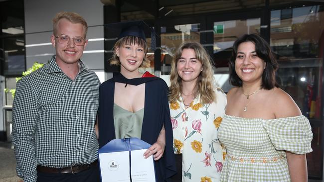 Michael Stevens, Alyssa Grace, Therese Grimes and Alexandra Iliopoulos celebrate graduation. Picture: Alan Barber