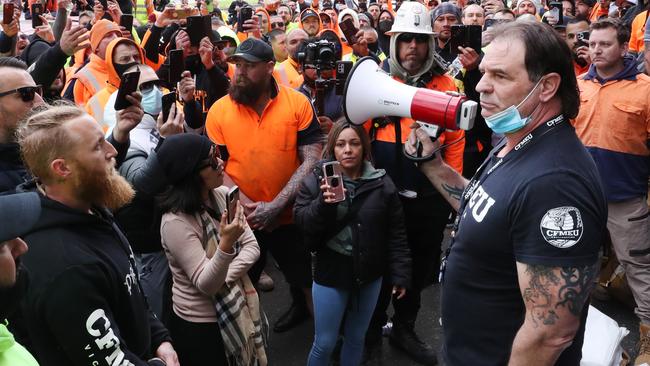 Victorian State Secretary of the CFMEU John Setka attempts to talk to construction workers during protests in Melbourne last week. Picture: David Crosling