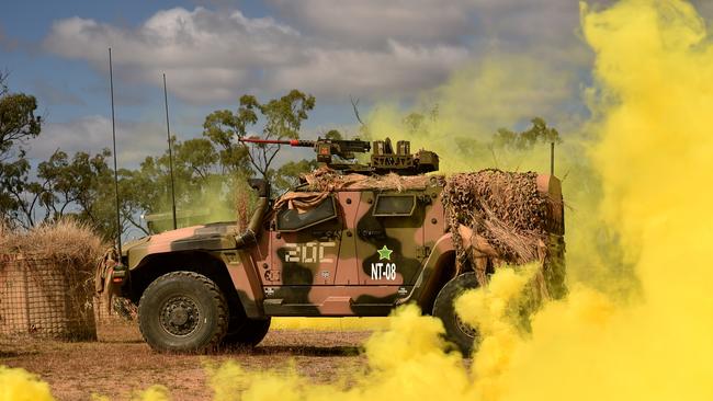 US Marines in conjunction with Australian soldiers from Battle Group Eagle comprising of elements of 3rd Brigade conduct an urban clearance of a fictitious invading force at the Townsville Filed Training Area. A armed vehicle from the fititious invading force defends Patrol Base Hadrian. Picture: Evan Morgan