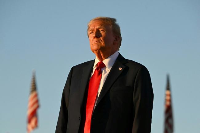 People attend a rally hosted by Republican presidential nominee Donald Trump at Dodge County Airport on October 06, 2024 in Juneau, Wisconsin