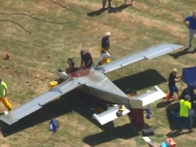 A plane flipped while landing in Melbourne's southeast on Saturday afternoon. , Emergency services were called to reports of the incident on French Island, 60km southeast of Melbourne, about 2.20pm., A pilot and two passengers were on board at the time., A man believed to be in his 60s was treated for lacerations and a leg injury., Ambulance Victoria said the man was in a stable condition and will be flown to the Royal Melbourne Hospital by air ambulance. Picture: Channel Nine