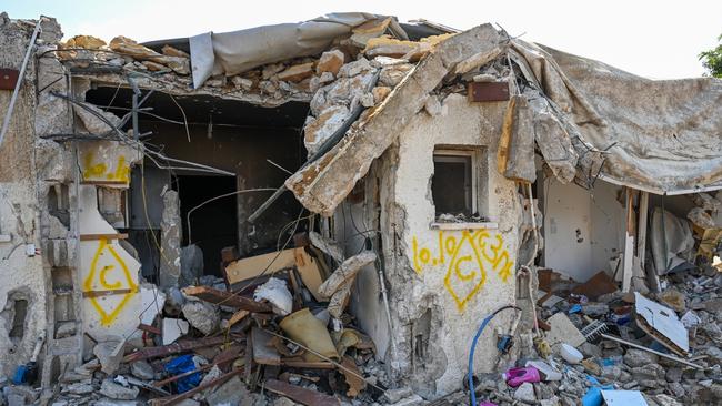 A house left in ruins after an attack by Hamas militants on a kibbutz days earlier when dozens of civilians were killed near the border with Gaza last October. Picture: Getty Images