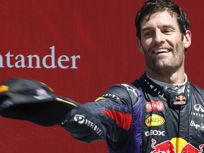 Mark Webber throws his hat to fans in 2013.  Picture:  AP