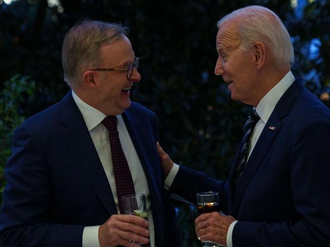 Mr Albanese also shared a picture of he and President Biden sharing drinks.