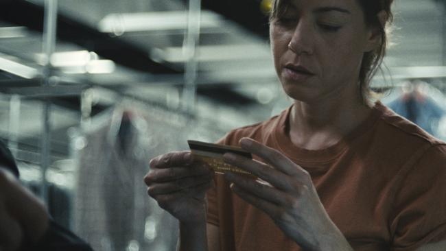 Aubrey Plaza making fake credit cards in a scene from Emily the Criminal.