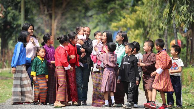 The formerly conjoined twins, Nima and Dawa Pelden, along with their mother Bhumchu and father Sonam, finally return to their home town of Phuntsholing near the border of India in Bhutan. A large family gathering turned out to welcome them home. Picture: Alex Coppel. 