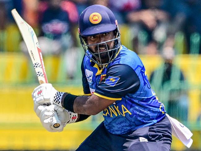 Sri Lanka's captain Charith Asalanka watches the ball after playing a shot. Picture: AFP