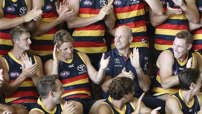 Crows coach Matthew Nicks surrounded by his players during team photo day. Picture: SARAH REED