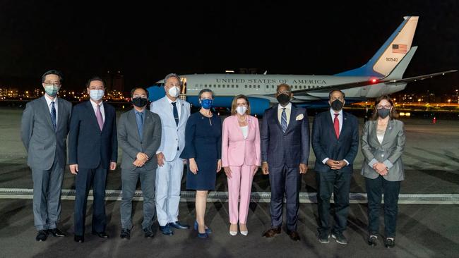 This handout picture taken and released by Taiwan’s Ministry of Foreign Affairs shows Speaker of the US House of Representatives Nancy Pelosi posing with her delegation upon their arrival at Sungshan Airport in Taipei.