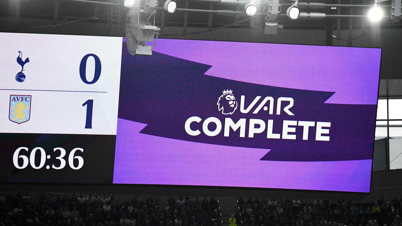 A VAR decision is shown on the big screens inside Tottenham Hotspur stadium. (Photo by Daniel LEAL-OLIVAS / AFP)