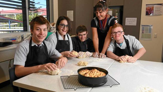 AT WORK: Sam Green, Chloe Coles, James Bould, teacher Kat White and Angus Birrell take part in the Kneaded program every Friday at Ipswich State High School. Picture: Rob Williams