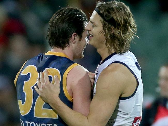 Patrick Dangerfield and Nat Fyfe embrace each other after their epic head-to-head contest in Round 9, 2015. Picture: Simon Cross